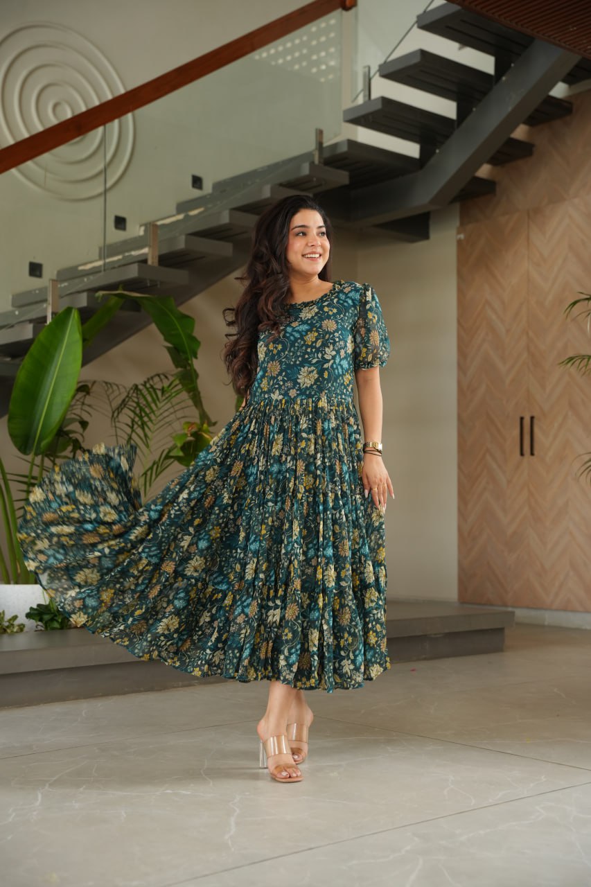Vikarni Green Printed Anarkali Gown in faux georgette with 12-meter flair – perfect ethnic wear for women, long gown for women, printed gown for girls, Anarkali gown for wedding, georgette gown for festive wear, Indian dress for women, traditional wear for haldi ceremony, party wear gown online, readymade gown under 1000, stylish green ethnic gown for mehndi function.